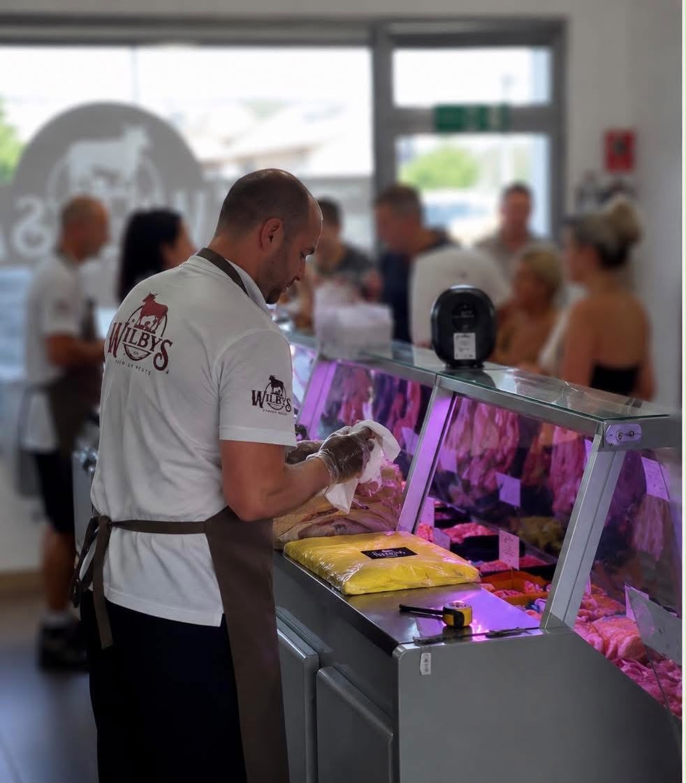 Wilbys team serving customers at the San Luis butcher shop